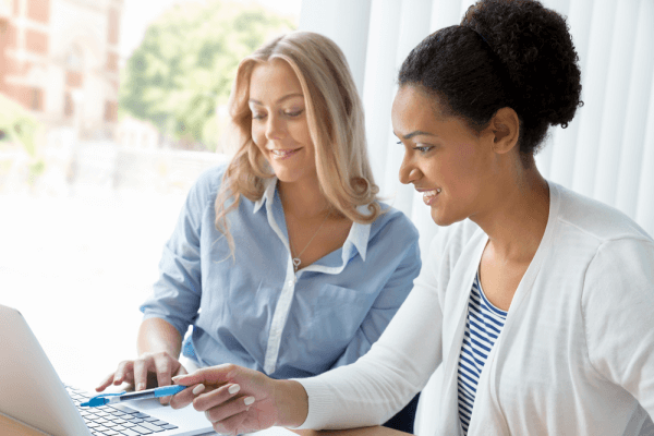 two women working together shutterstock 262915874