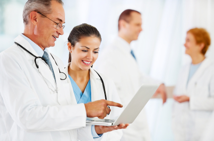 stock photo 19735922 two doctors looking at the laptop