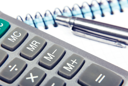 pen with calculator and a notebook