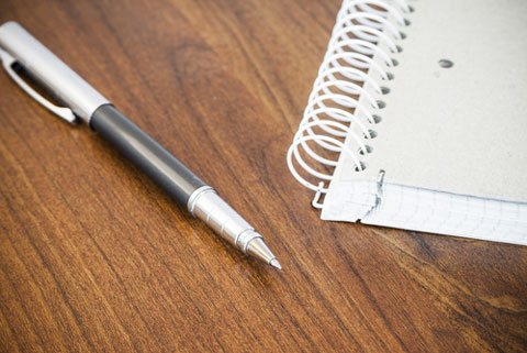 shutterstock 213614002 pen and coiled notebook