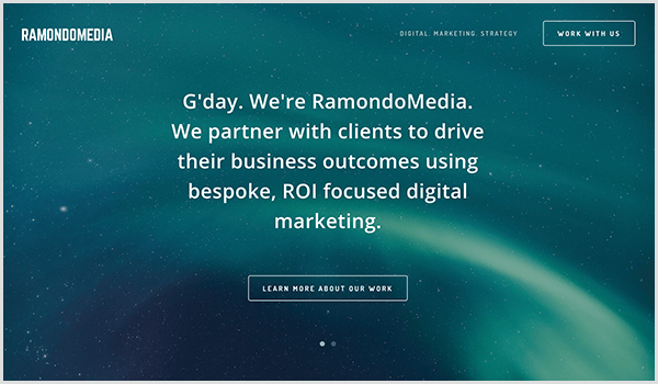 The RamandoMedia website has a dark blue background with stars and streaks of light. Over the picture, white text and a button appears. The text says G'day. We're RamondoMedia. We partner with clients to drive their business outcomes using bespoke, ROI-focused digital marketing. The button text says Learn More About Our Work. 