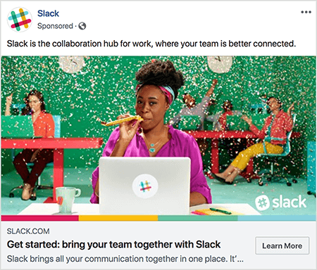 This is a screenshot of a Facebook ad for Slack. The ad text says “Slack is the collaboration hub for work, where your team is better connected.” In the ad image, a black woman sits at a desk with a gray laptop. Her hair is short and held back with a colorful headband. She’s wearing a fuschia blouse and turquoise necklace, and she’s blowing through a yellow noisemaker. In the background, other people are sitting at desks and wearing colorful clothing. The office is painted bright green, and confetti is falling from the ceiling. Talia Wolf recommends using photos like this, which show raw emotion, in your ads.