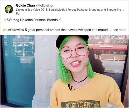 This is a screenshot of Goldie Chan sharing a video with a clear takeaway. The text above the video says “ 5 Strong LinkedIn Personal Brands Let’s review 5 great personal brands that have developed into matur. . . see more”. In the video image, Goldie appears from the chest up. She’s an Asian woman with green hair. She’s wearing makeup, a black choker necklace, and a yellow shirt. A video filter makes it look like she’s wearing red glasses sketched with a marker.