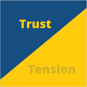 This is an square illustration of Seth Godin’s observation that some companies try to eliminate tension in their marketing. The square is a blue triangle in the upper left and a yellow triangle in the lower right. In the blue triangle, yellow text says Trust. In the yellow triangle, blue text says Tension but it’s almost transparent and fading into the yellow background.