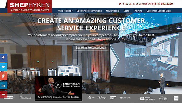 This is a screenshot of Shep Hyken’s website. In the background, he’s speaking to a large crowd in front of a projection screen. The website text says “Create an amazing customer service experience. Your customers no longer compare you to their competitor. They compare you to the best service they ever had . . . from anyone.”