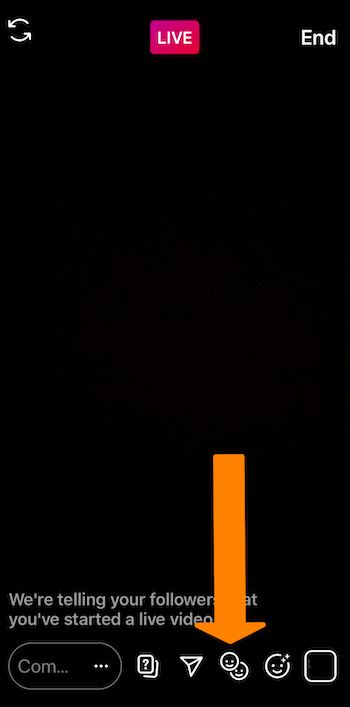 screenshot of an Instagram Live broadcast with an orange arrow pointing to the smiley faces icon at the bottom of the screen