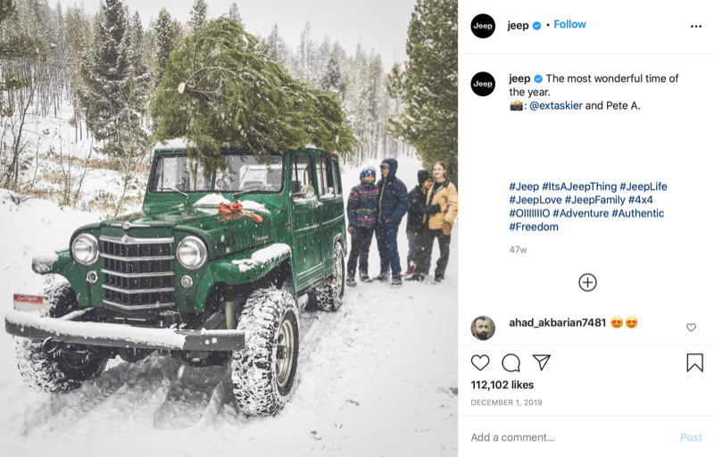 instagram post from @jeep showing a family at the end of christmas tree hunting with a tree on the top of their jeep, deep in snow and tree country